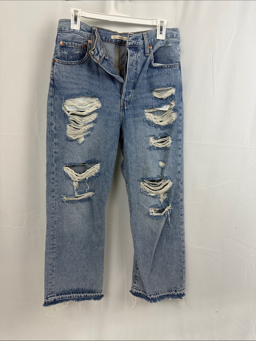Levi- women’s straight leg, button fly.